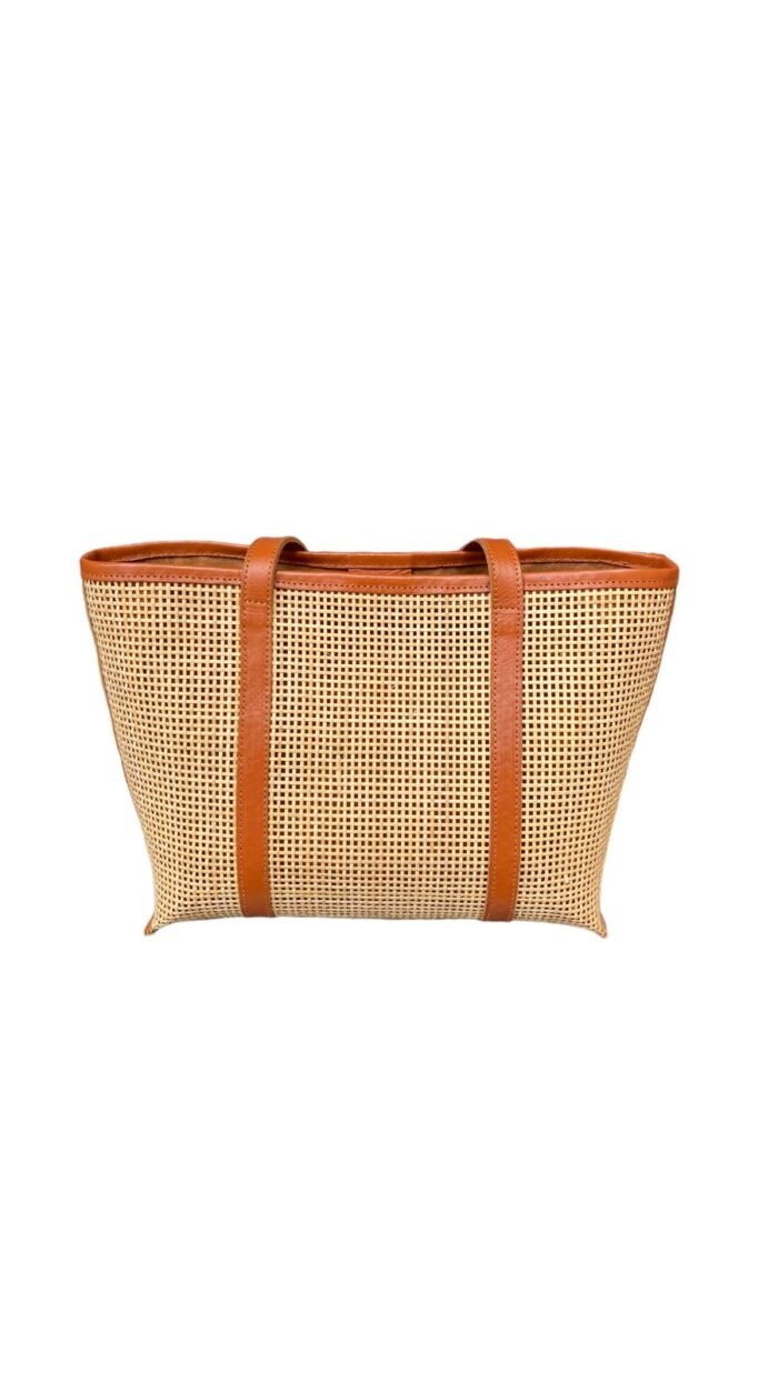 This stylish handbag is handcrafted in Bali using natural rattan material, The intricate weave creates a unique, one-of-a-kind design that is perfect for adding a touch of rustic charm to any outfit.