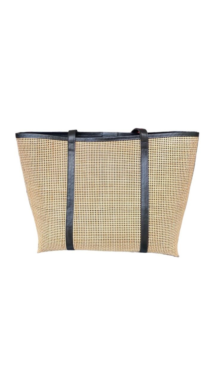 This stylish handbag is handcrafted in Bali using natural rattan material, The intricate weave creates a unique, one-of-a-kind design that is perfect for adding a touch of rustic charm to any outfit.