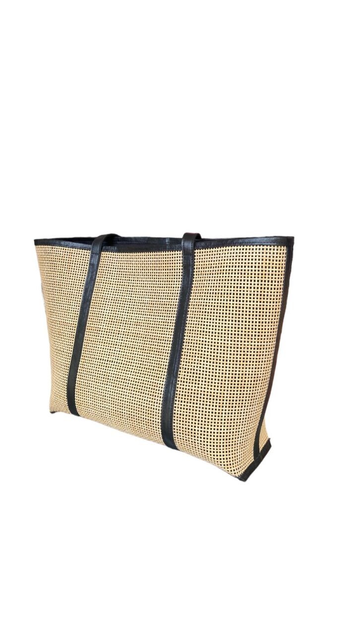 This stylish handbag is handcrafted in Bali using natural rattan material, The intricate weave creates a unique, one-of-a-kind design that is perfect for adding a touch of rustic charm to any outfit.