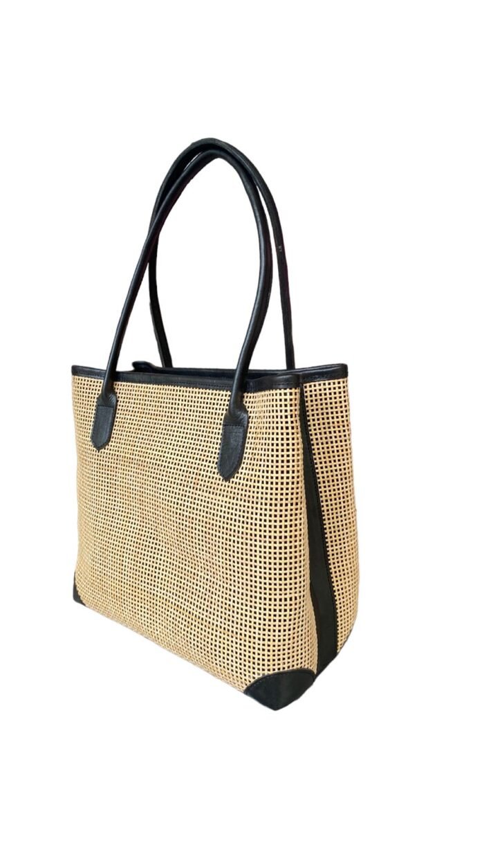 This stylish handbag is handcrafted in Bali using natural rattan material, The intricate weave creates a unique, one-of-a-kind design that is perfect for adding a touch of rustic charm to any outfit.