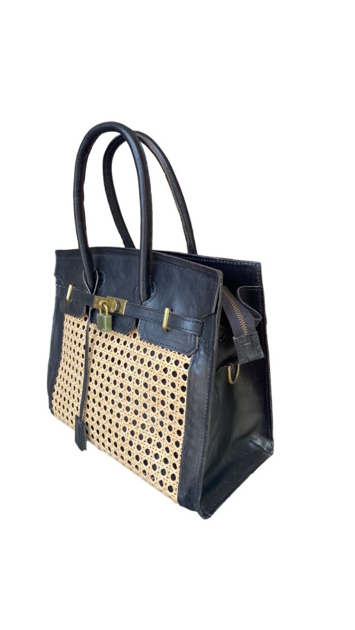 This stylish handbag is handcrafted in Bali using natural rattan material, The intricate weave creates a unique, one-of-a-kind design that is perfect for adding a touch of rustic charm to any outfit.