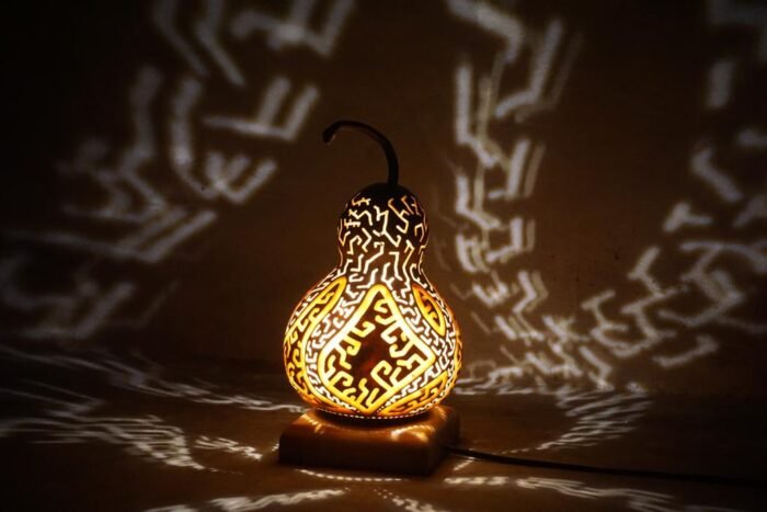 The Bali Flexible Gourd is a functional and visually stunning piece of home decor that adds elegance and sophistication to any room. With an intricate shadow pattern inspired by traditional Balinese art, it can be customized to suit your needs thanks to its flexible design. -Led Lamp 4 Watt , E27 Input 220 Volt AC -Finishing Pernish Holder Iron Wood Size : Length : 20 cm , Width : 20 cm , Height : 30 cm | Shipping Weight : 0.5 Kg