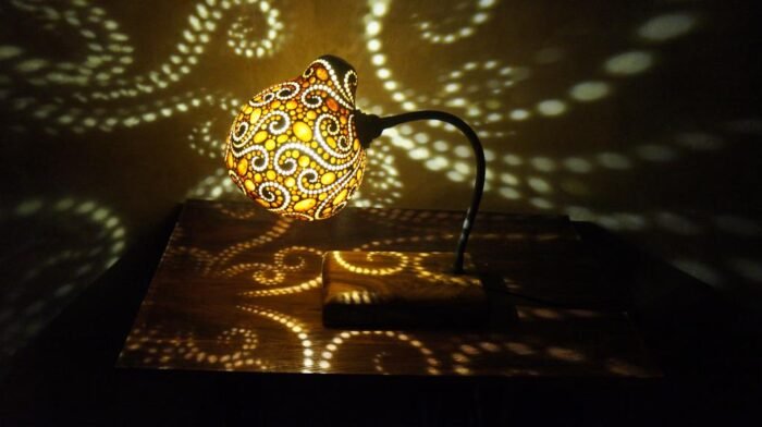 The Bali Flexible Gourd is a functional and visually stunning piece of home decor that adds elegance and sophistication to any room. With an intricate shadow pattern inspired by traditional Balinese art, it can be customized to suit your needs thanks to its flexible design. - LED Lamp 4 Watt : E27 Input 220 Volt Ac - Finishing Pernish Holder Iron Wood Size : Length : 23 CM , Width 23 CM : , Height : 50 CM | Shipping Weight : 2 KG