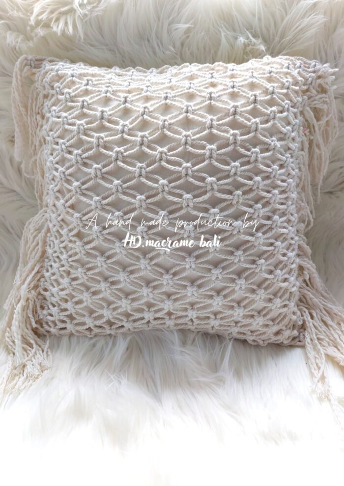 The Bali macrame pillow cover is a handcrafted home decor item, inspired by the natural beauty and cultural heritage of Bali. Made from high-quality cotton, it features a stunning geometric pattern and is both soft and durable.