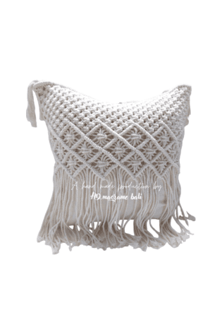 The Bali macrame pillow cover is a beautiful and intricately designed home decor item that brings a touch of elegance and bohemian flair to any room. The cover is meticulously handcrafted by skilled artisans in Bali, Indonesia, using traditional macrame techniques that have been passed down through generations. The pillow cover features a stunning geometric pattern that is woven into the fabric using a combination of knotting and weaving techniques. The design is inspired by the natural beauty and cultural heritage of Bali, with its lush tropical landscapes, vibrant colors, and rich artistic traditions. Made from high-quality cotton, the pillow cover is soft, durable, and easy to care for. It is also hypoallergenic and safe for people with sensitive skin. The natural cotton fibers provide a comfortable and breathable surface that is perfect for snuggling up with on the couch or adding an extra layer of comfort to your bed. The Bali macrame pillow cover is designed to fit most standard-sized pillows, and it features a hidden zipper that allows for easy removal and washing. The cover is also reversible, so you can switch up the look of your room by simply flipping the pillow over. Whether you're looking to add a touch of bohemian chic to your bedroom or create a cozy reading nook in your living room, the Bali macrame pillow cover is the perfect choice. With its stunning design, high-quality craftsmanship, and versatile style, this pillow cover is sure to become a favorite in your home for years to come.