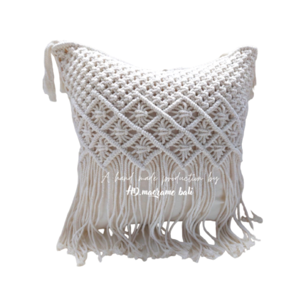 The Bali macrame pillow cover is a beautiful and intricately designed home decor item that brings a touch of elegance and bohemian flair to any room. The cover is meticulously handcrafted by skilled artisans in Bali, Indonesia, using traditional macrame techniques that have been passed down through generations. The pillow cover features a stunning geometric pattern that is woven into the fabric using a combination of knotting and weaving techniques. The design is inspired by the natural beauty and cultural heritage of Bali, with its lush tropical landscapes, vibrant colors, and rich artistic traditions. Made from high-quality cotton, the pillow cover is soft, durable, and easy to care for. It is also hypoallergenic and safe for people with sensitive skin. The natural cotton fibers provide a comfortable and breathable surface that is perfect for snuggling up with on the couch or adding an extra layer of comfort to your bed. The Bali macrame pillow cover is designed to fit most standard-sized pillows, and it features a hidden zipper that allows for easy removal and washing. The cover is also reversible, so you can switch up the look of your room by simply flipping the pillow over. Whether you're looking to add a touch of bohemian chic to your bedroom or create a cozy reading nook in your living room, the Bali macrame pillow cover is the perfect choice. With its stunning design, high-quality craftsmanship, and versatile style, this pillow cover is sure to become a favorite in your home for years to come.