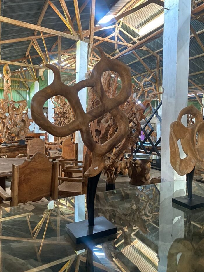 Introducing the Jati Root Home Decoration - a captivating masterpiece that blends the beauty of teak wood with the charm of Bali. Handcrafted with precision, this impressive decor piece adds elegance to your home, entrance, or hotel lobby. Its unique design reflects skilled artistry and durability. making it a versatile addition to any decor style. Embrace the allure of Bali's beauty and the timeless appeal of teak wood with this extraordinary creation. http://balibya.com/wp-content/uploads/2023/08/WhatsApp-Video-2023-08-01-at-16.58.45.mp4