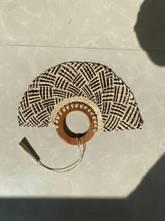 Made in bali with and worked by highly experienced craftsmen makes this jewellery or lamp cover decoration a great choice to decorate yourself and your home! Experience the essence of Bali with our eco-friendly Bali Natural Hand Fan. Crafted from natural leaves and recycled wood, this unfoldable fan showcases the artistry of local elderly artisans who macrame each piece. Stay cool, stylish, and socially conscious with this unique masterpiece.